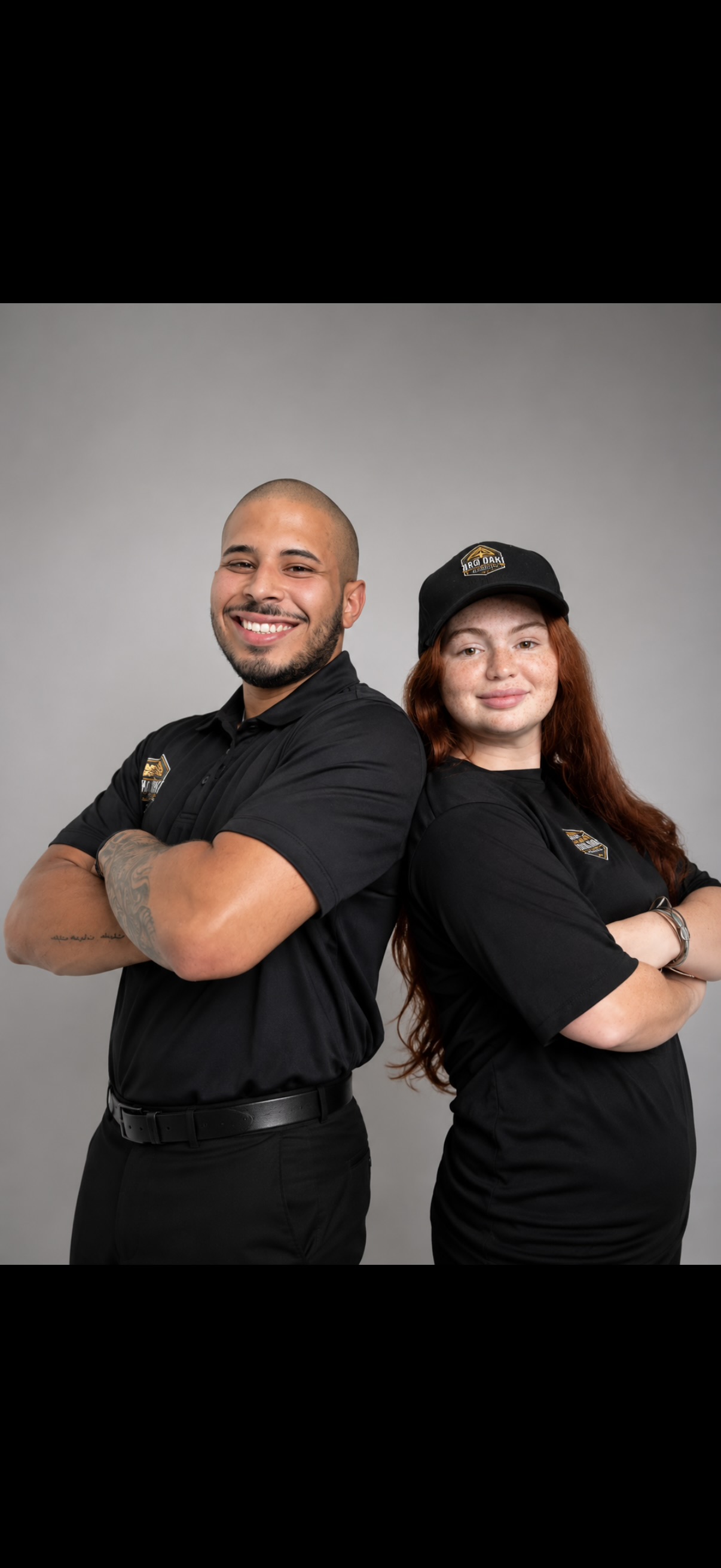 Ralph and Amalee wearing their Iron Oak Hauling shirts
